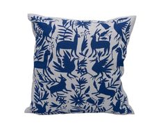 a blue and white pillow with deer on it