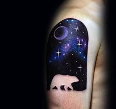 a man's arm with a bear and stars on it