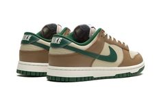 The Nike Dunk Low “Rattan/Gorge Green” is a colorway of the retro basketball shoe with earth and neutral tones on its design.  The “Rattan/Gorge Green” Dunk Low features a tan leather base contrasted with Rattan leather overlays.  A Gorge Green leather Swoosh appears on the sides, while more green detailing can be seen on the leather heel tab with “Nike” embroidery.  Gorge Green “Nike” and Swoosh logos appear on the tongue tag.  Underfoot, a Sail midsole and Gorge Green outsole complete the look.  Release date: March 1, 2024 Green Nike Shoes, Nike Embroidery, Black Men Fashion Urban, Sb Dunks, Retro Basketball Shoes, Retro Basketball, All Nike Shoes, Shoes Outfit Fashion, Cute Nike Shoes