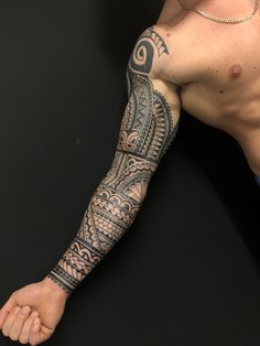 a man with a tattoo on his arm