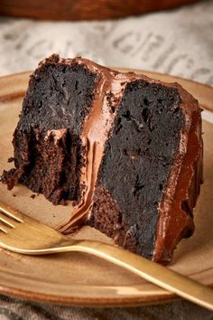 a piece of chocolate cake on a plate with a fork