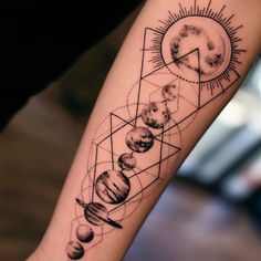 a person with a tattoo on their arm that has planets and sun in the middle