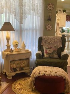 a living room with a chair and ottoman