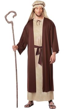 a man dressed in biblical clothing and holding a staff