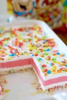 a cake with sprinkles on it sitting on a table