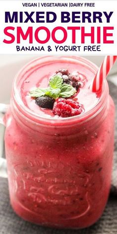 a smoothie in a mason jar with strawberries and mint