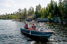 two people in a small boat on the water