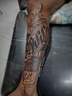 a man with a tattoo on his leg