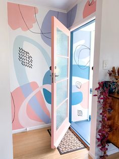 an open door leading into a colorful room