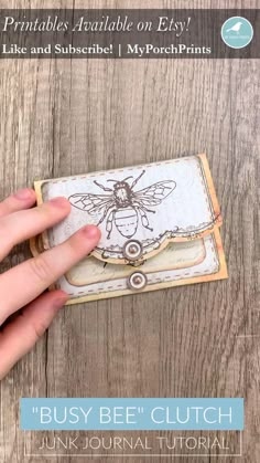 someone is holding an envelope with a drawing on it and the words, busy bee clutch