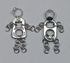 two metal key chains are attached to each other