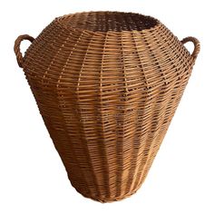 a large wicker basket with handles is shown on a white background for use as a vase