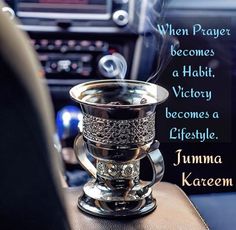 a cup that is sitting on top of a car dashboard with the words when prayer becomes a habit, victory becomes a lifestyle