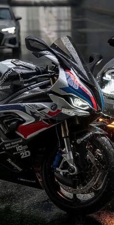 two motorcycles parked next to each other on the street