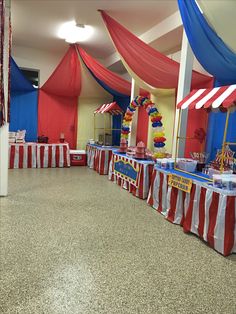 an indoor event with red, white and blue decorations on the tables for children's birthdays