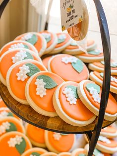 an assortment of orange and green decorated cookies