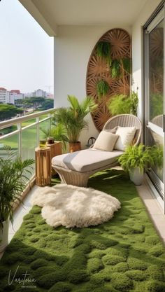 a balcony with green carpet and plants on it