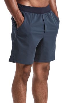 Athletic Fit Bottoms With Built-in Shorts, Solid Color Athleisure Shorts With 5-inch Inseam, Workout Shorts With Elastic Waistband And 5-inch Inseam, Casual Running Bottoms With 5-inch Inseam, Relaxed Fit Bermuda Shorts With 5-inch Inseam, Sporty Bottoms With Built-in Shorts And Athletic Fit, Activewear With Built-in Shorts And 4-way Stretch, Casual Athletic Shorts With 5-inch Inseam For Sports, Gym Shorts With Elastic Waistband And 5-inch Inseam