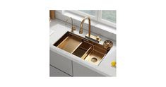 a kitchen sink with two faucets in it