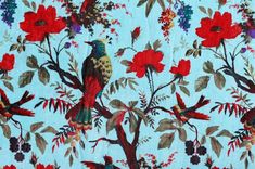 a blue background with birds and flowers on it