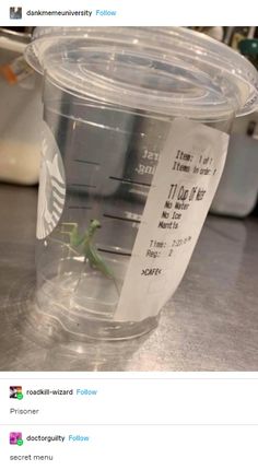 a plastic cup with a small green lizard on it's side and a receipt attached to the lid