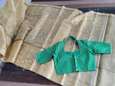 Blouse stitched - Yes Blouse Opening - Back Sleeves Length - Elbow Padded - No Blouse size - 38 with inner margins expandable upto 44 For Blouse Size 36 alteration can be done on request. Fall/pico - Yes done All over embroidery work comes only for Pallu part. Green Blouse With Chikankari Embroidery, Green Fitted Cotton Silk Top, Fitted Green Cotton Silk Top, All Over Embroidery, Tissue Silk Saree, Silk Saree Blouse, Elbow Pads, Embroidery Work, Saree Blouse