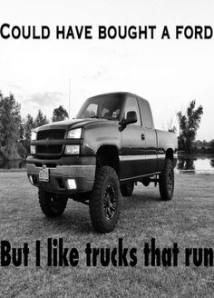 a black and white photo of a truck with the words, could have bought a ford but i like trucks that run