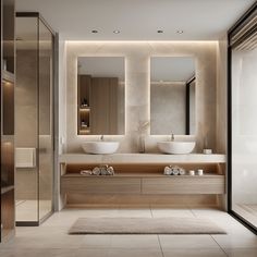 a modern bathroom with two sinks and large mirrors on the wall, along with an area rug