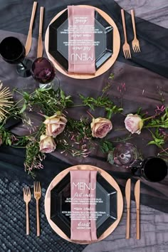 an overhead view of a table setting with flowers and place settings on the plateware