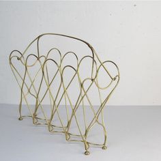 a gold metal rack with hearts on it