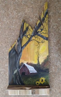 a piece of art that looks like a barn on a hill with trees and flowers in the foreground