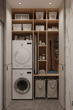 a washer and dryer in a small room with wooden shelves on the wall