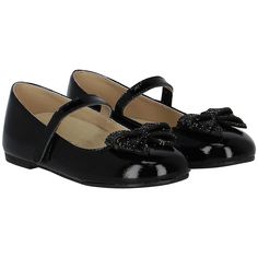 Black shoes for girls by Babywalker. Made from soft patent leather, they feature a bow with embellished sparkling black rhinestones on the front and fasten with adjustable velcro straps. Finished with breathable leather padded inner soles and durable rubber soles. Comes with branded box.  #babywalkergirlsshoes #patentleathershoes #bowdetailshoes