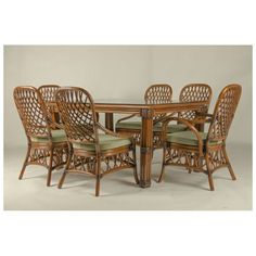 an image of a dining table and chairs with green cushions on the backrests