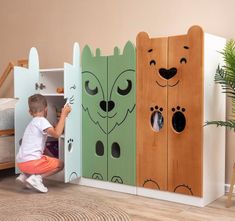 a little boy playing with wooden toys in a room