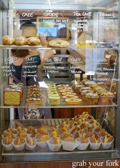 a display case filled with lots of different types of pastries