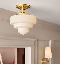 a light fixture in a room with white walls