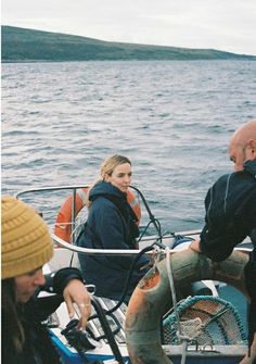 some people on a boat in the water