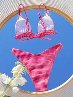 Make a splash this summer with our Trendy Plaid Triangle Bikini. This stylish bikini set features a classic plaid print with a chic bow accent, giving you a fashionable and timeless beach look. The triangle top offers adjustable straps for a perfect fit, while the low waist thong bottom provides a flattering silhouette. Designed with high-quality materials, this bikini ensures comfort and durability for all your beach and pool adventures. The bandage style adds a trendy touch, making this swimsuit a must-have for your summer wardrobe. Elevate your swimwear collection with the Trendy Plaid Triangle Bikini and turn heads wherever you go! The Triangle, Triangle Top, Beach Look, The Low, Plaid Print, Swimwear Collection, Low Waist, Summer Wardrobe, This Summer