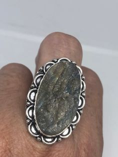 Huge blue green Labradorite rainbow moonstone Lovely vintage silver setting is low content silver Size 8.5 Ring is long covers from knuckle to knuckle. All rings are shipped in a nice gift box. Check out our over a THOUSAND great reviews Engraving is $4 per letter and is not always perfect depending on the piece. It can take a few days if the jeweler is busy. This is payable to Paypal Judithsltd@gmail.com Vintage Labradorite Rings For Gift, Handmade Silver Labradorite Crystal Ring, Handmade Silver Crystal Ring With Labradorite, Vintage Labradorite Gemstone Rings, Vintage Labradorite Ring, Vintage Silver Crystal Ring With Natural Stones, Vintage Moonstone Ring With Large Stone For Gift, Vintage Moonstone Ring With Large Stone As Gift, Silver Crystal Ring With Labradorite Stones