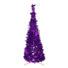 a purple tinsel christmas tree on a white stand against a white background with no people around it