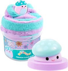 a cupcake shaped toy next to a container with it's lid on top