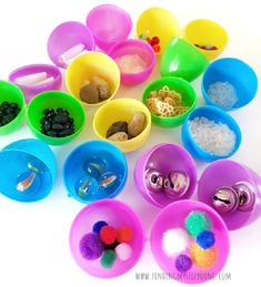 several bowls filled with different colored items on a white surface