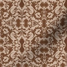 a brown and white wallpaper with an intricate design on the back half of it