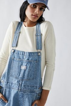 The perfect vintage-inspired overalls from Levi's, this distressed style is featured in a classic bib-and-brace silhouette with front pouch pocket and relaxed, straight leg design. * Adjustable straps * Four pocket design * Side button closures * Logo patch detail at front | Levi's Vintage Overalls at Free People in Light Wash, Size: XS White Overalls, Vintage Overalls, Bib Overalls, Leg Design, Vintage Levis, Dungarees, Pocket Design, Boho Outfits, Pocket Pouch