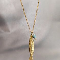 Necklace Details: The Necklace And The Pendant Made From 14 Karats Solid Yellow Gold. Chain Length 20inch/ 50cm'. Fish Pendant Size: 1.3x0.25inch/ 33x6mm. A Goldfish Necklace With The Good Eye Stone That Will Lead Us On The Right Path . Chain Available In All Sizes, Color Gold And Karat And Matte Or Shining Finish. Each Pendant Is Custom-Made, Unique, And Will Have Slight Variations In Shape. If You Want To Change Something, Width, Length, Personal Engraving, Or Anything Else. Please Contact Me. Elegant Yellow Gold Fish Shaped Necklace, Gold Fish-shaped Necklace For Gift, Goldfish Necklace, Gold Fish Necklace, Fish Necklace, Fish Pendant, Gold Fish, Eye Stone, Custom Necklace