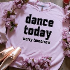 Step into style with our "Dance Today, Worry Tomorrow" sweatshirt, designed for all the passionate movers out there! Whether you're a ballerina, dance coach, or simply love to groove, this retro sweatshirt offers the perfect blend of comfort and charm. With its college-style font and cozy fit, it's the ideal fall sweater for anyone who lives to dance. Looking for the perfect gift for a dancer? This stylish dance shirt is a great choice for birthdays, holidays, or as a surprise "just because." It Dance Sweatshirt, Dance Coach, Statement Sweatshirt, Ballerina Dance, Dance Shirt, Dancer Gift, Dance Lover, 80s Sweater, Dance Shirts