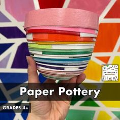 a hand holding a paper pot in front of a colorful wallpaper background with text overlay