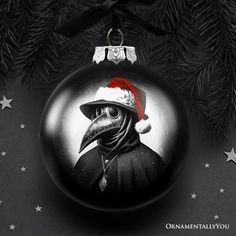 a christmas ornament with a bird wearing a santa hat