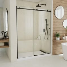 a bathroom with a tub, sink and shower stall in the middle of it's walls